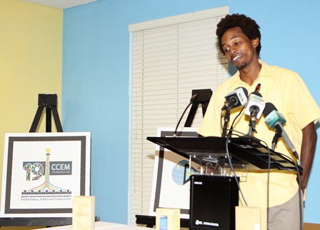 Daniel Hanna, winner of the logo design competition for the 19th Conference of Commonwealth Education Ministers talks about his winning entry during a press conference at the Ministry of Education, Science and Technology. (BIS Photo/Patrick Hanna)